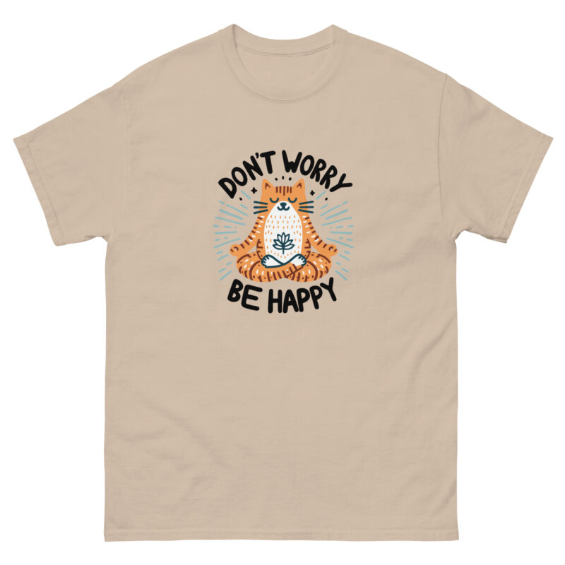 The "Don't Worry Be Happy" Evolve Shirt showcases an adorable orange cat meditating. Encircled by the calming message, "Don't worry, be happy," this shirt in light beige is ideal for sharing positivity and tranquility.